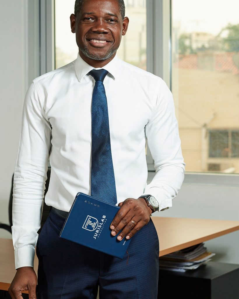 two-smiling-businesspeople-using-a-laptop-together-in-an-office_1 - 01